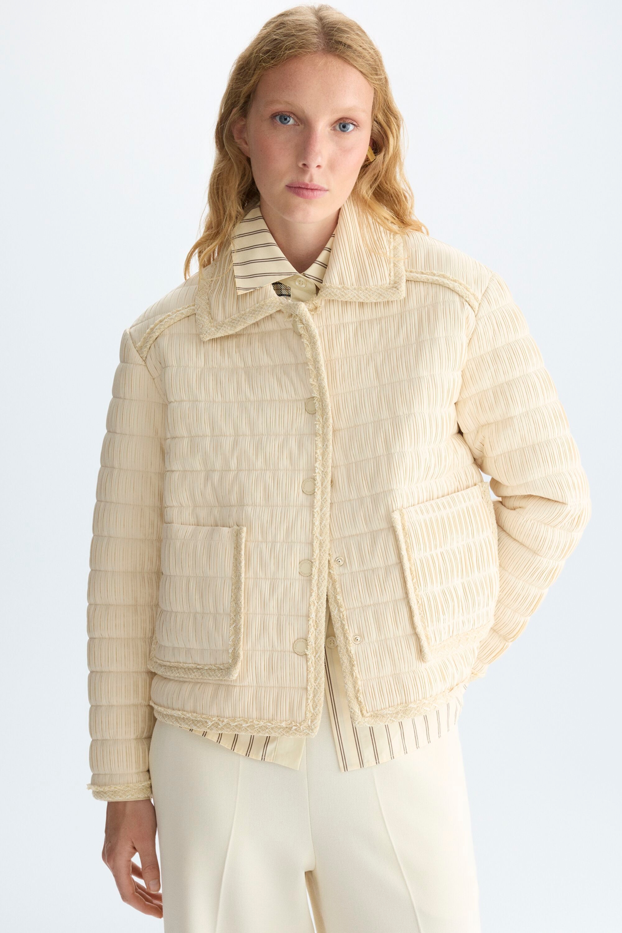 Quilted pleated nylon A-line jacket