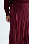 Semi-sheer pleated knit wrap skirt