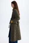 Origami-quilted nylon trench coat with detachable skirt