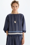 Camiseta oversize combinada estampado patchwork denim
