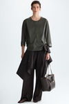 Faux-leather jersey A-line t-shirt with flaps