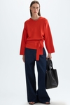 Stretch-knit oversize sweater with belt