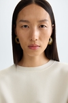 Stretch-knit oversize sweater with belt